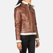Close-Up Detail of High Neck with Belt &amp; Zipper Hardware on Women's Fiona Brown Hooded Shearling Leather Jacket
