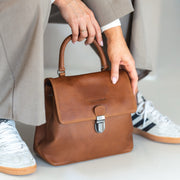 Styled Fit Perspective of Angera Full-Grain Leather Handbag Damska on Model - Natural Daylight Drape