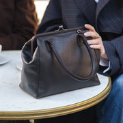 Styled Fit Perspective of Dorin Full-Grain Leather Handbag Damska on Model - Natural Daylight Drape