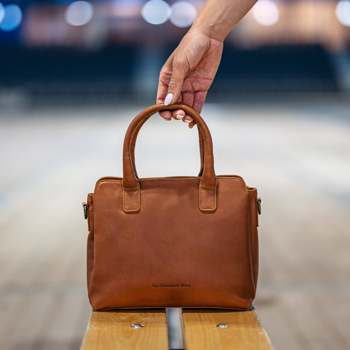 Styled Fit Perspective of Hermosa Full-Grain Leather Handbag Damska on Model - Natural Daylight Drape
